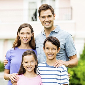 Smiling family of four