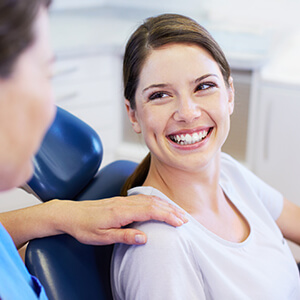 Female patient smiling in dental chair