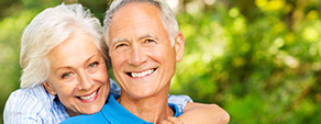 Older couple smiling brightly